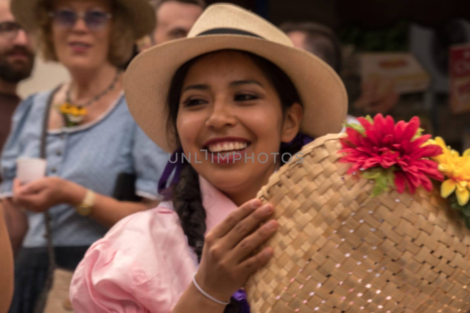 Villach, Austria - August 3th, 2019: A smiling lady from Ecuador at the procession of 'Villacher Kirchtag', the largest traditional folk festival in Austria.