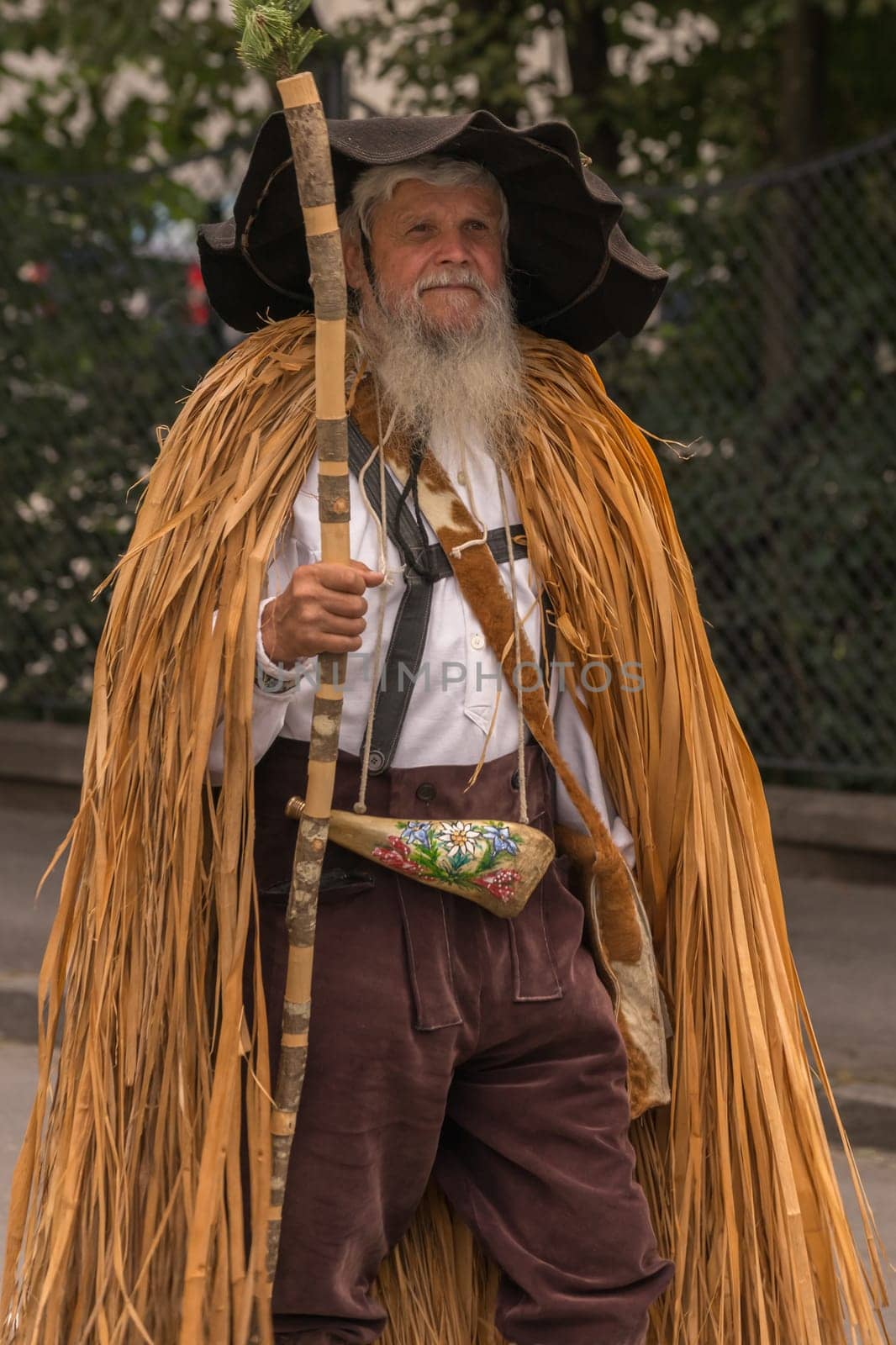 Villach, Austria - August 3th, 2019: A uniquely dressed, bearded man at the procession of 'Villacher Kirchtag', the largest traditional folk festival in Austria.
