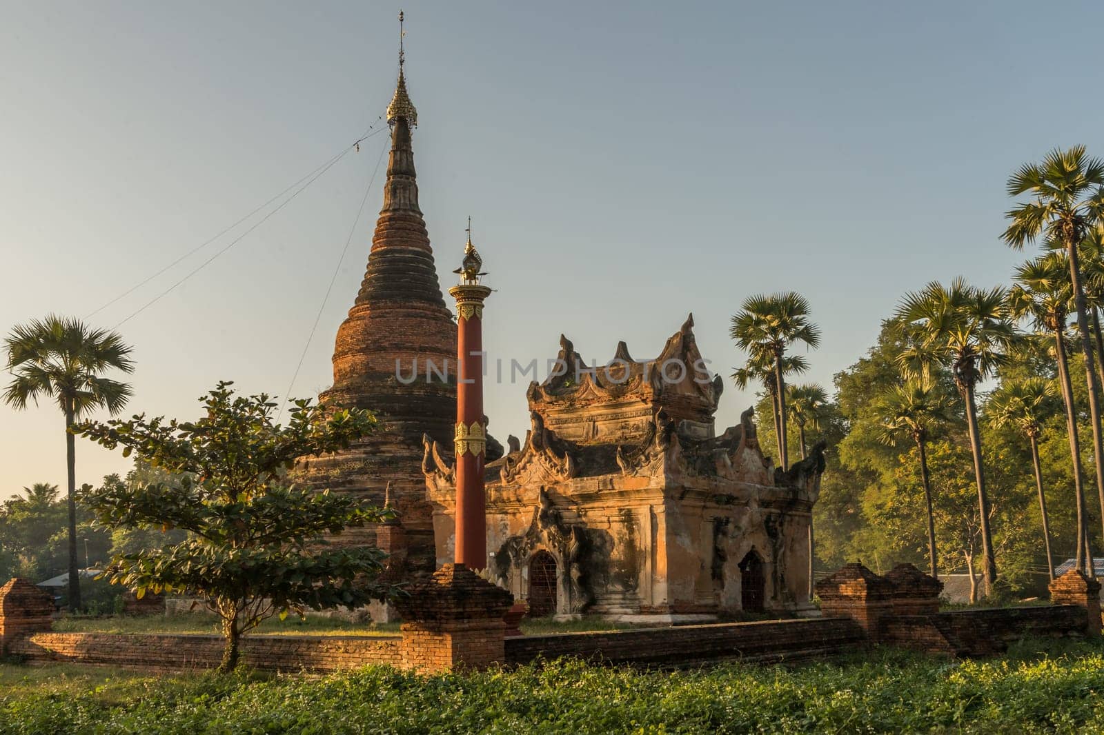 A small temple complex located in Hanthawaddy at the Inwa areal nearby Mandalay during sunset