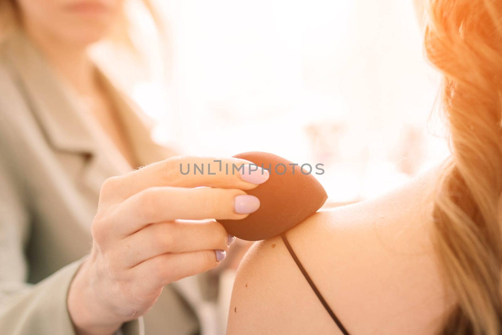 Woman applying by professional make up master. Beauty club conception
