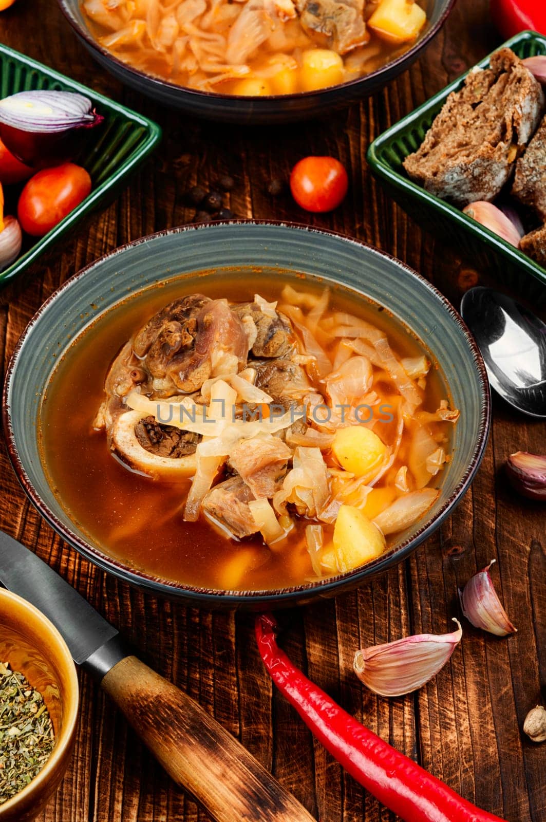 Tasty borshch, soup with meat on the table. Traditional Ukrainian Russian borscht.