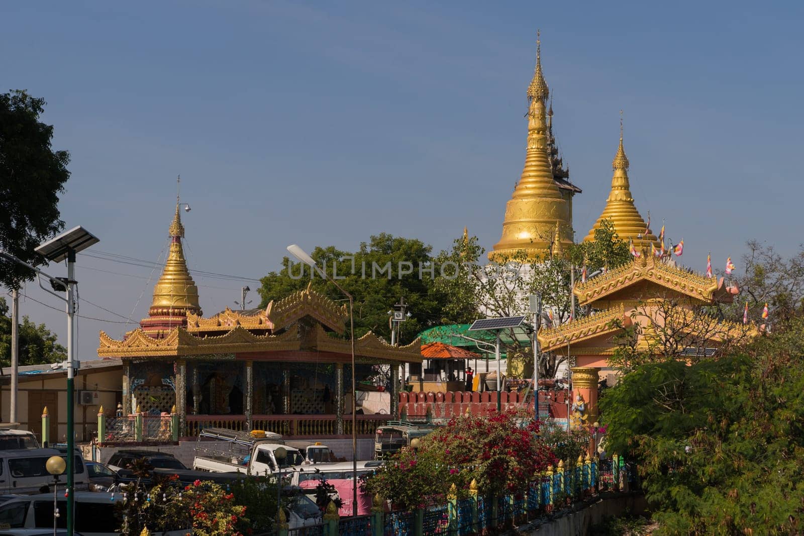 Sagaing, Myanmar - January 16th, 2019: View to the lively entrance of the famous Soon U Ponya Shin Pagoda at Sagaing Hill in Myanmar