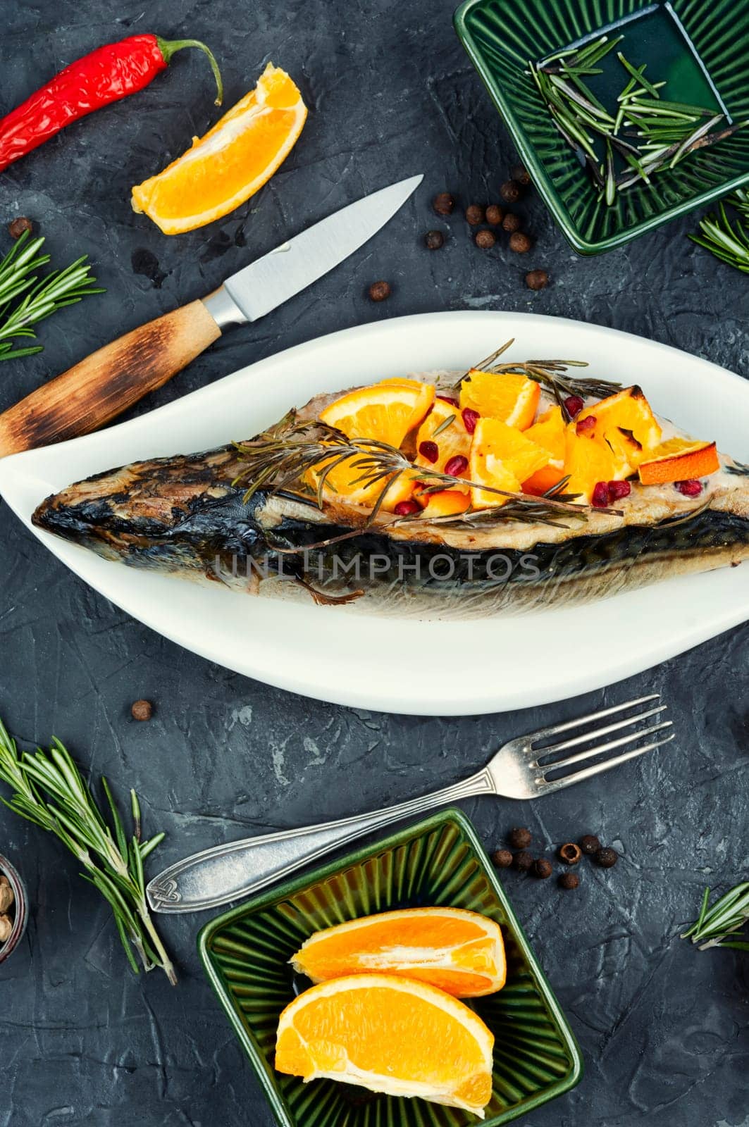 Roasted mackerel fish with oranges.