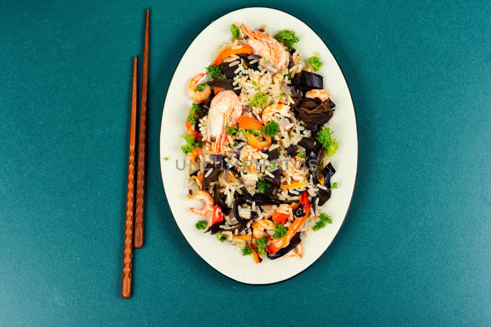 Chinese food, fried rice with shrimp and mushrooms. Asian food style. Top view.