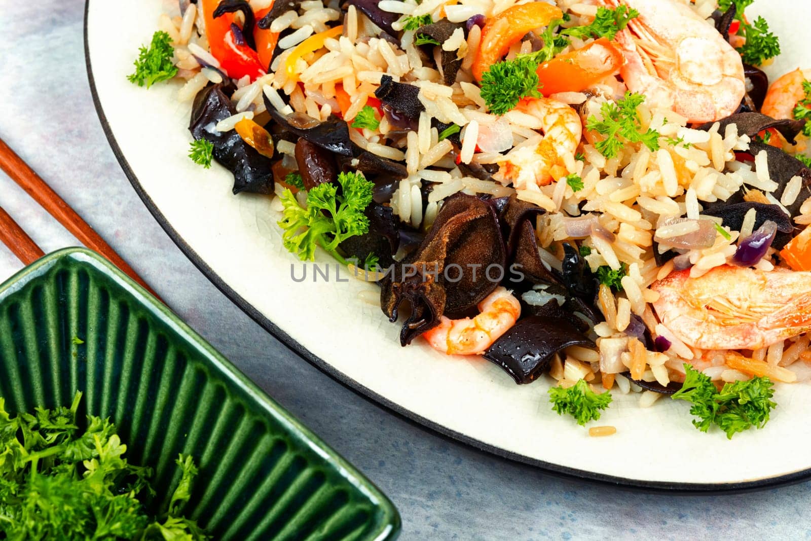 Chinese food, fried rice with shrimp and mushrooms. Asian food style. Top view.