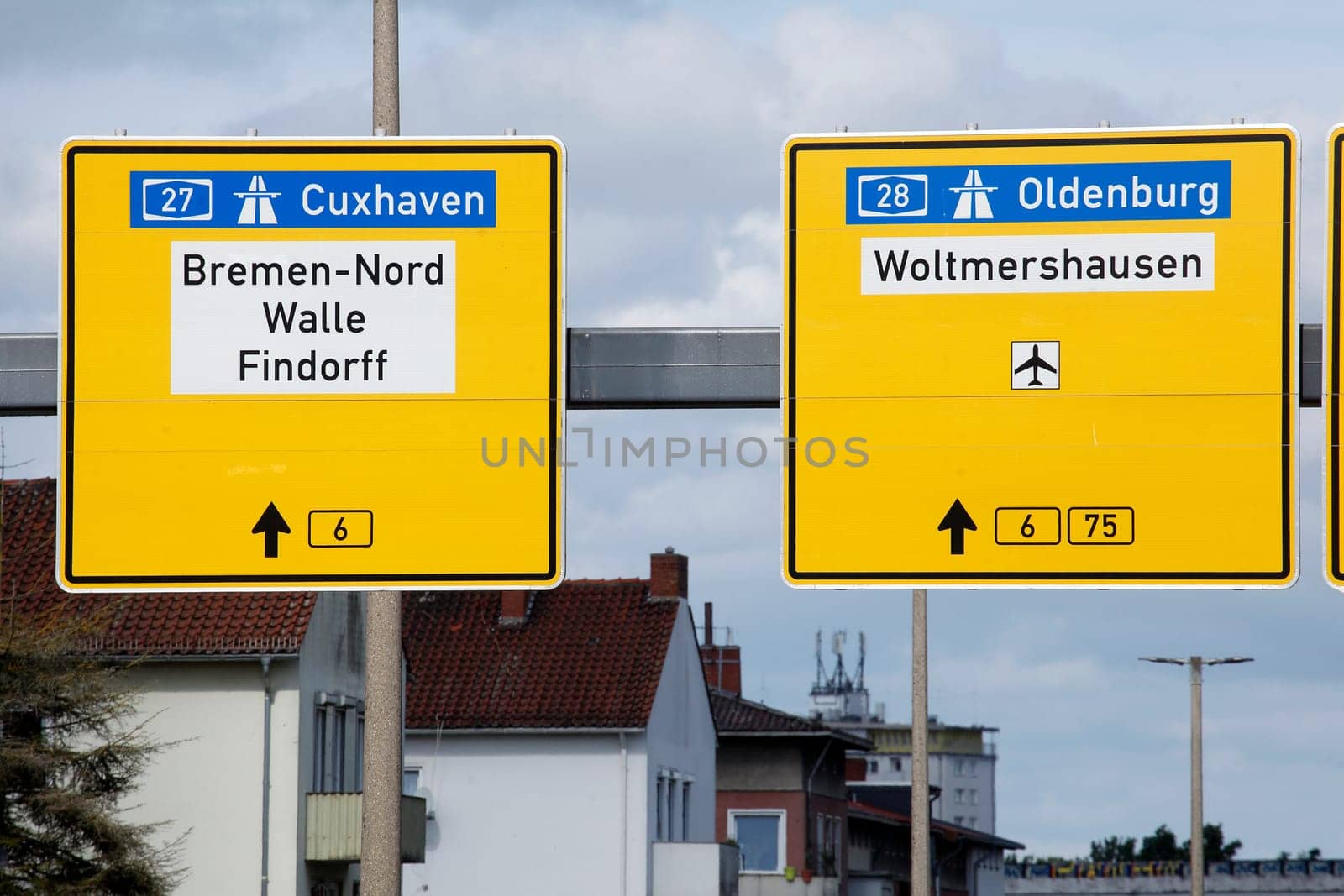 Signposts to the highway and country road, residential buildings, Bremen, Germany