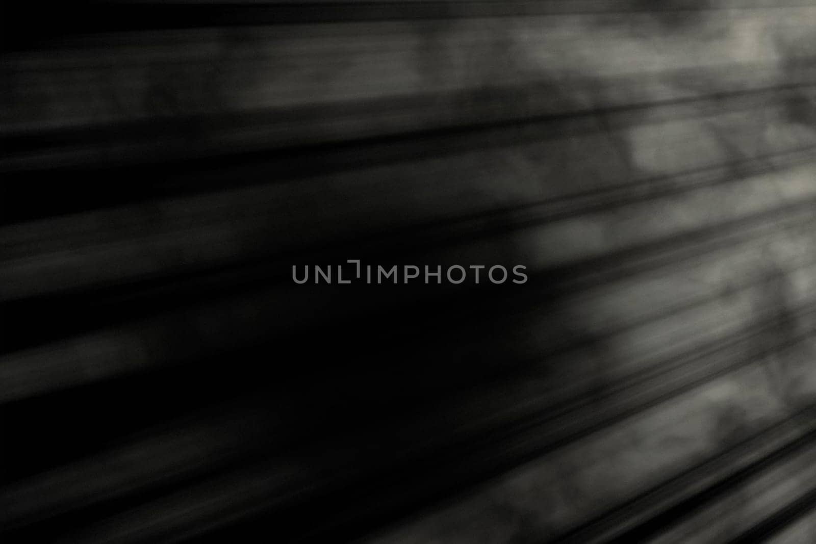 Gray-white horizontal light on the right side on a black background