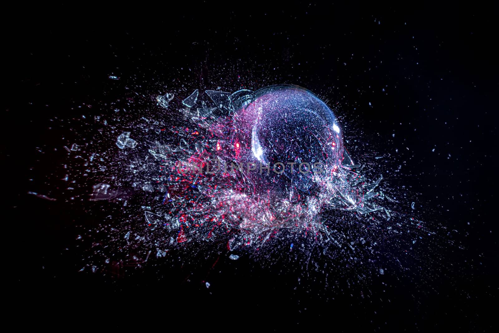 explosion of a glass ball on a black background. high-speed photography