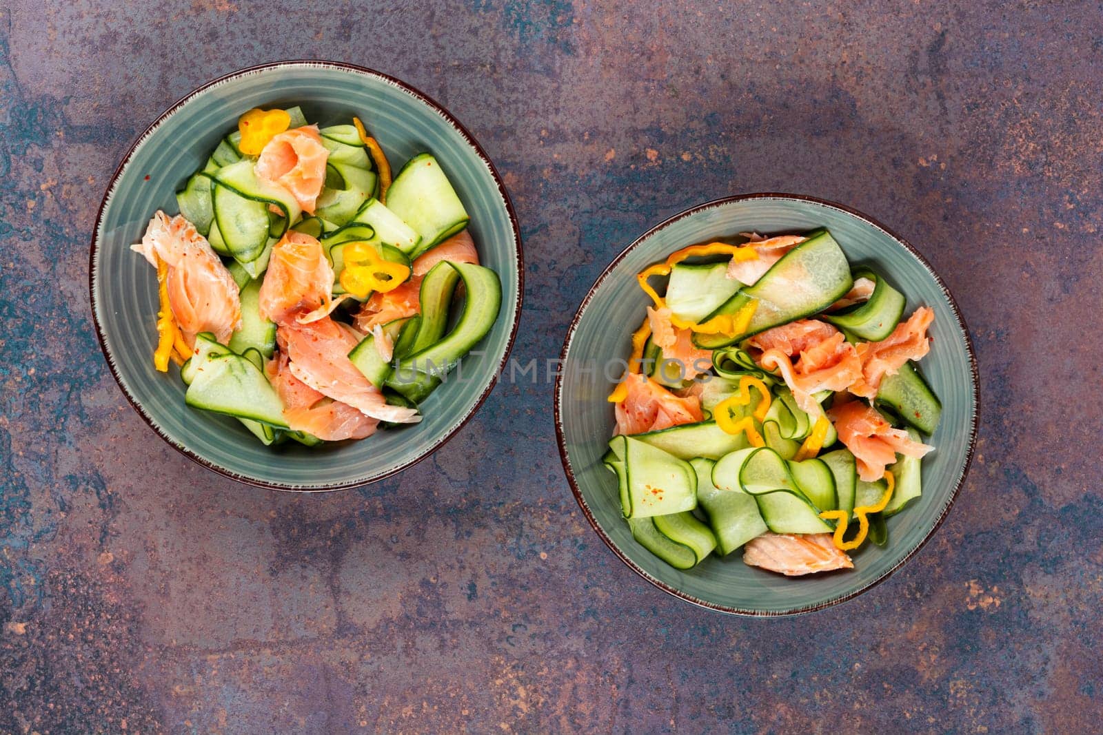 Salmon salad food, salmon fillet with fresh cucumber. Asian cuisine.