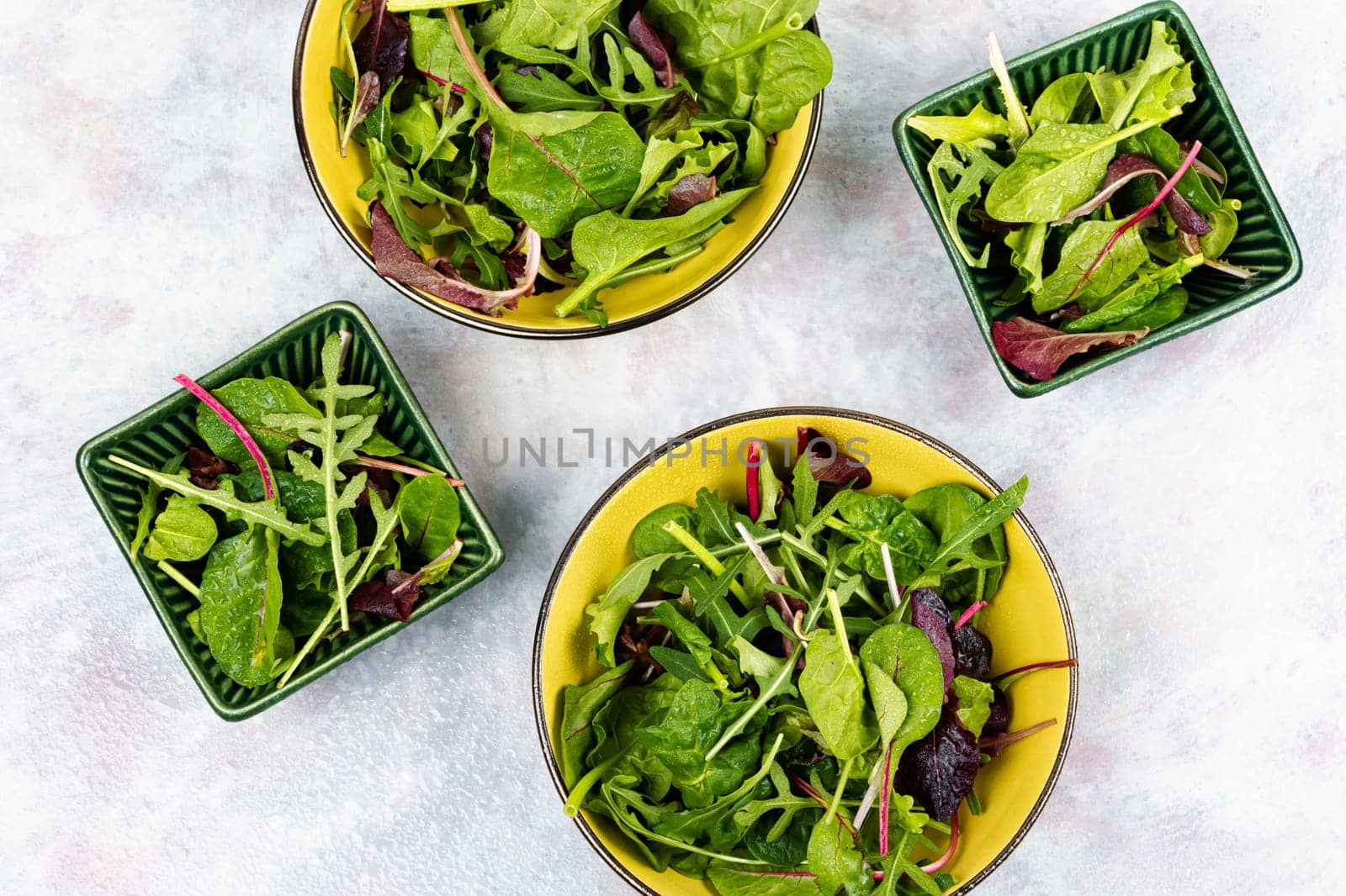 Green vegan salad made from mixed green leaves. Green food. Top view.