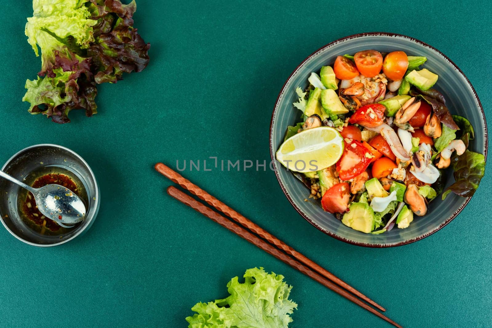 Mix salad with seafood, shrimp, scallop, octopus, squid and fresh vegetables.