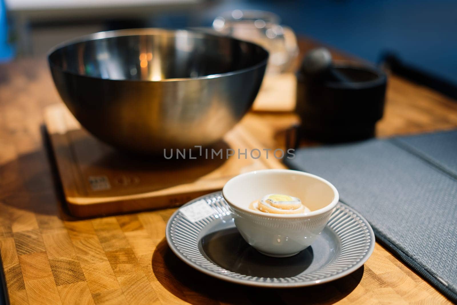 Wooden kitchen utensils stacked view, spoons, bowls plate