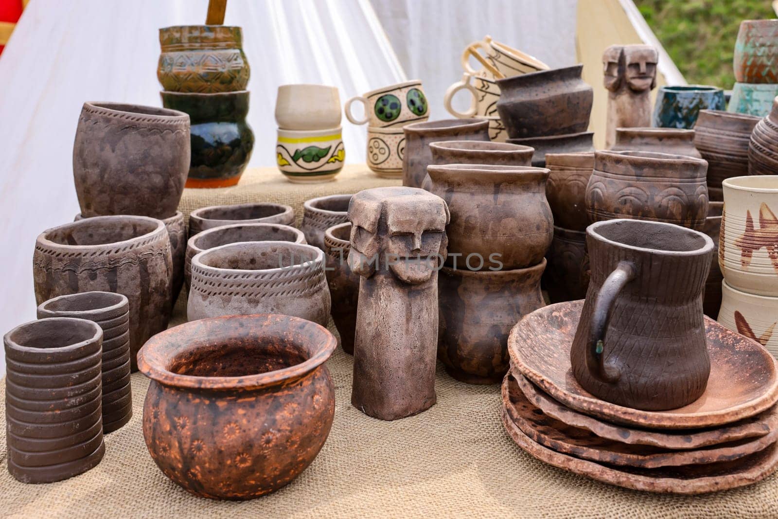 Cracow, Poland - April 11, 2023: Handmade imitations of medieval ceramic vessels in knight camp at the festival of historical reconstruction