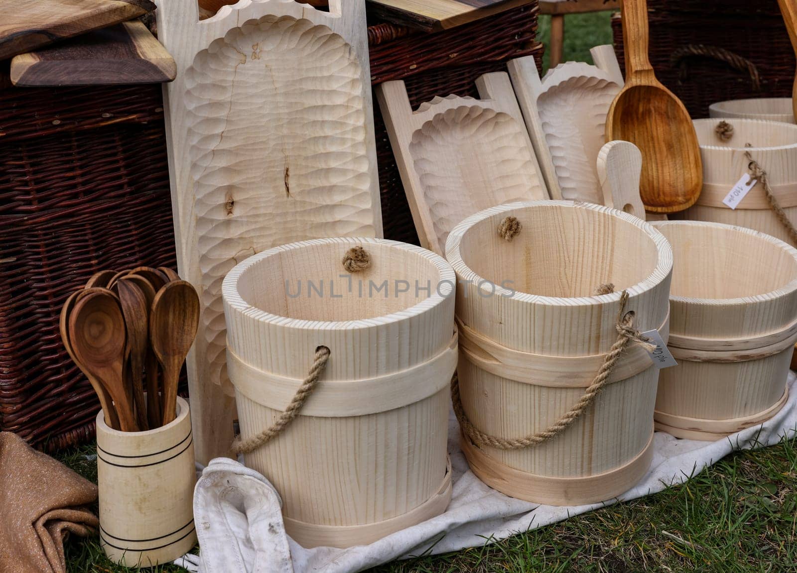 Cracow, Poland - April 11, 2023: Imitations of old wooden vessels in knight camp at the festival of historical reconstruction