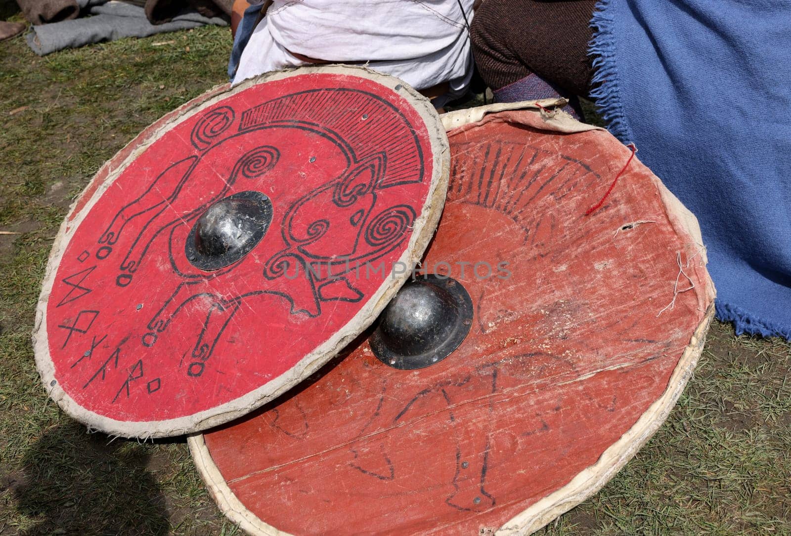 Medieval weapons, shields in knight camp at the festival of historical reconstruction