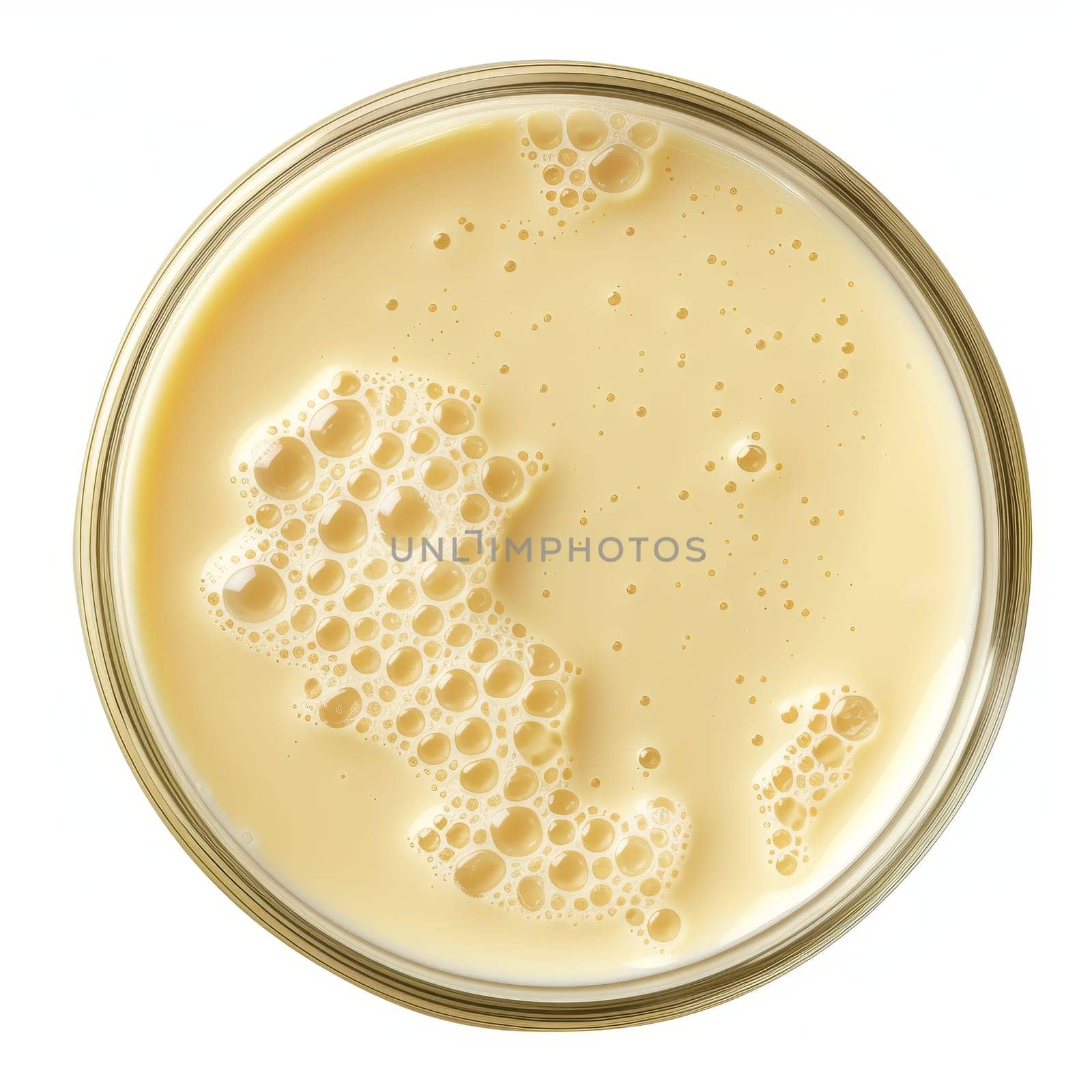 Close-up view of condensed milk's surface texture showing bubbles and creaminess