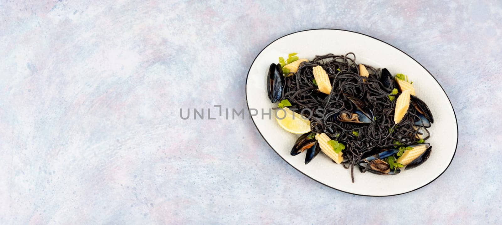 Vegan black bean pasta with boiled mussels. Spaghetti with seafood. Pasta vongole.