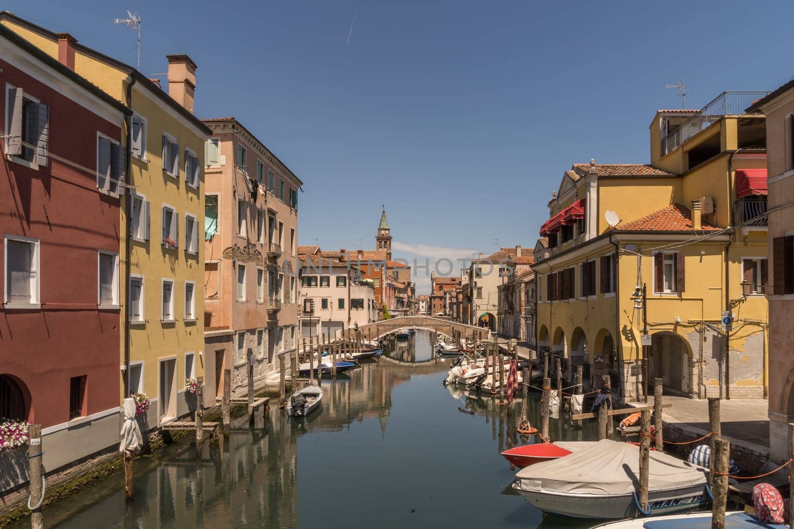 Chioggia, Italy - July 10th, 2022: View over the old town along one of the canal of the pleasant medieval city of Chioggia.