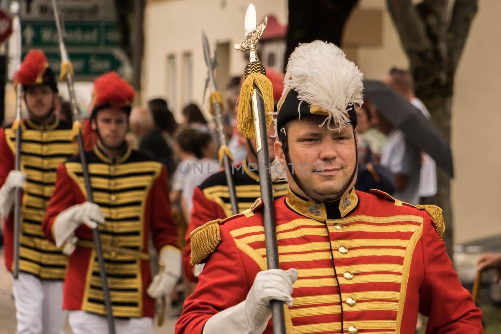 Villach, Austria - August 6, 2022: Participants wearing traditional uniform at the procession of 'Villacher Kirchtag', the largest traditional folk festival in Austria, after some years of cancellation due to Covid.