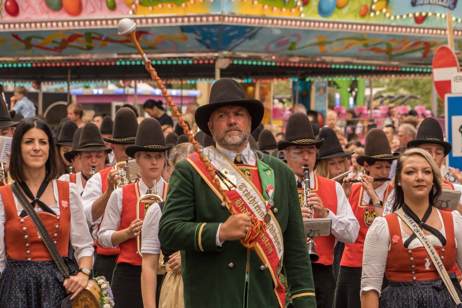 Villach, Austria - August 6, 2022: Musicians enjoy the procession of 'Villacher Kirchtag', the largest traditional folk festival in Austria, after some years of cancellation due to Covid.