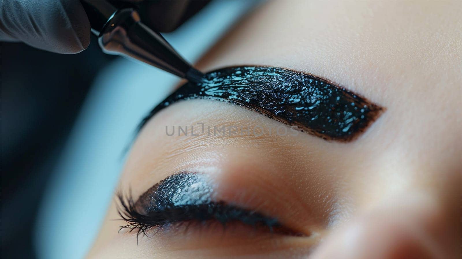 Close-up of eyebrow tint application for perfect shape.coloring with henna and natural products.Precision Eyebrow Tinting.