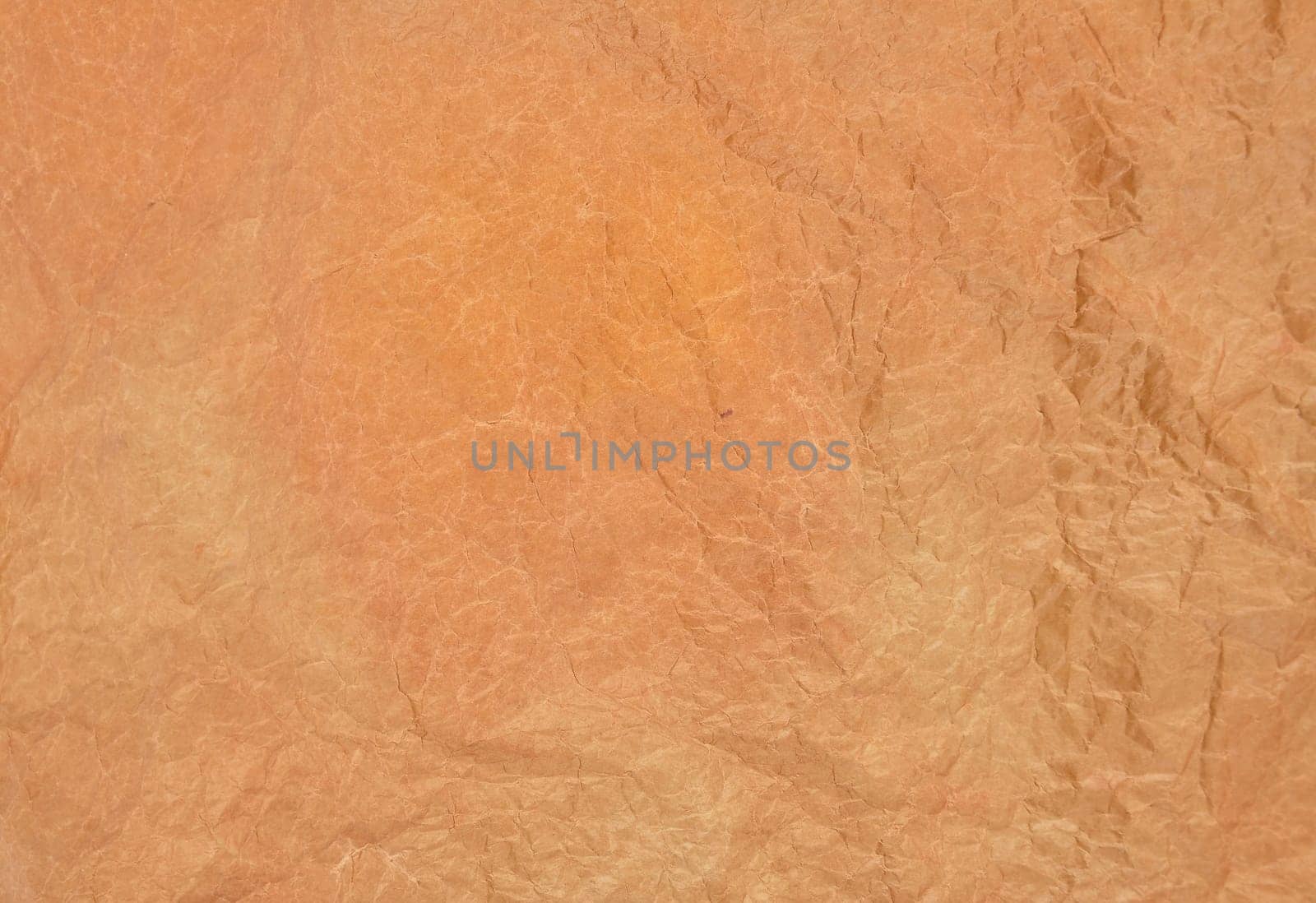 Brown crumpled baking paper as a background