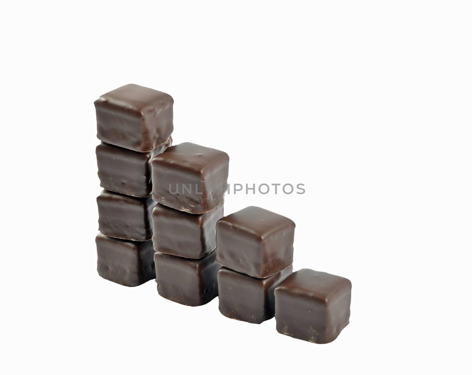 Dominosteine lined up in stacks on white background