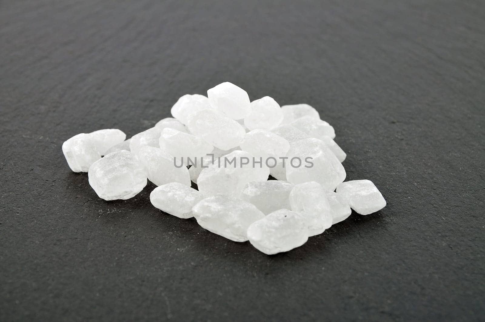 Several rock candy on dark background