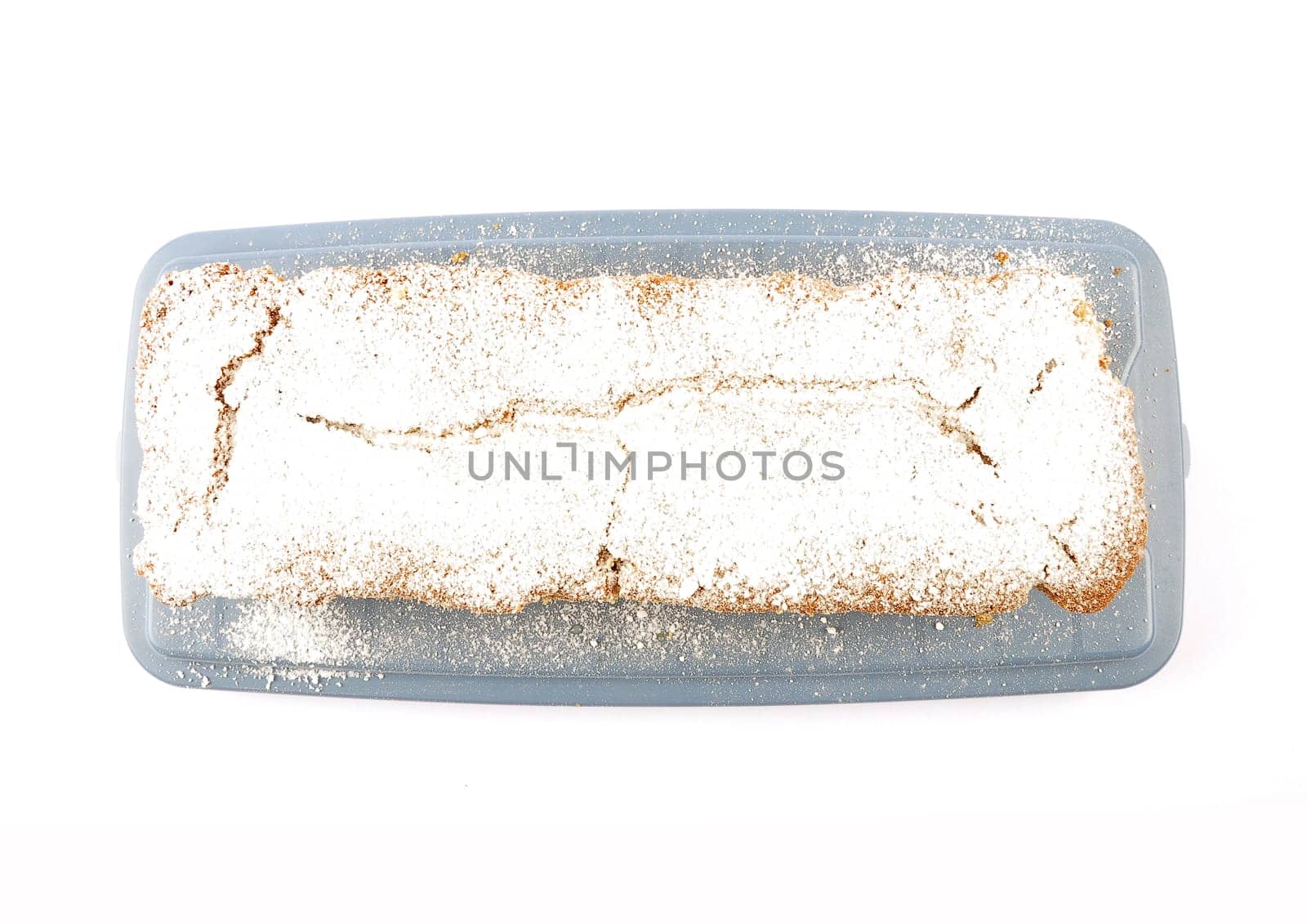 Freshly baked sand cake on cake plate and white background