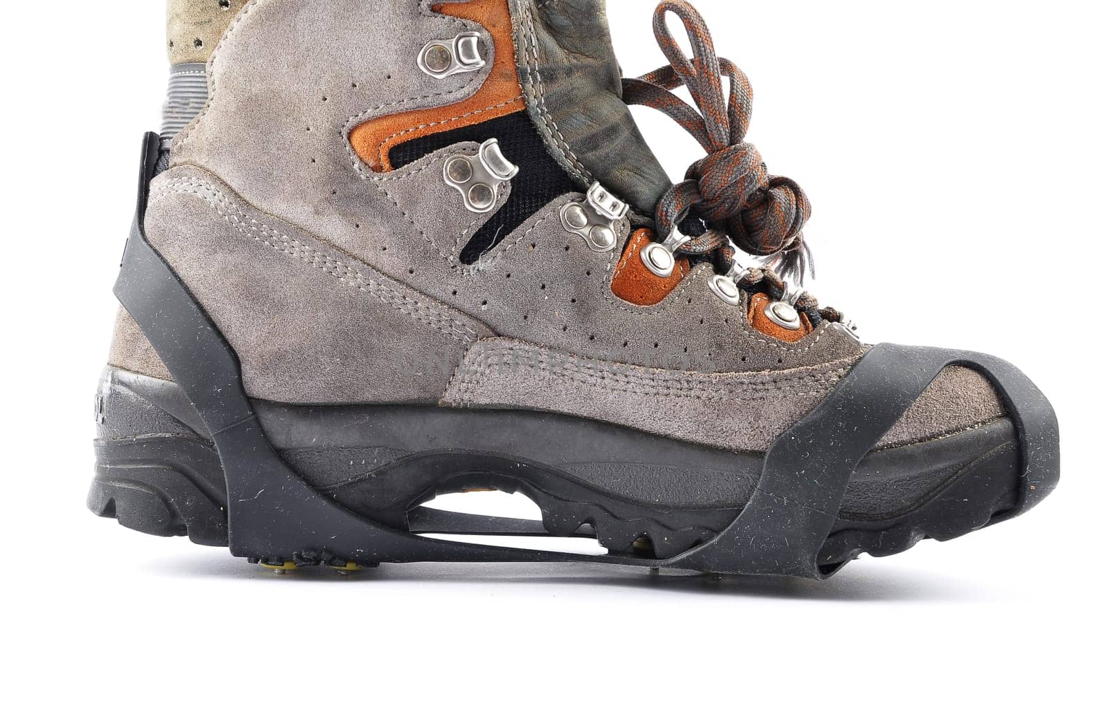 Hiking shoes with spikes on a white background