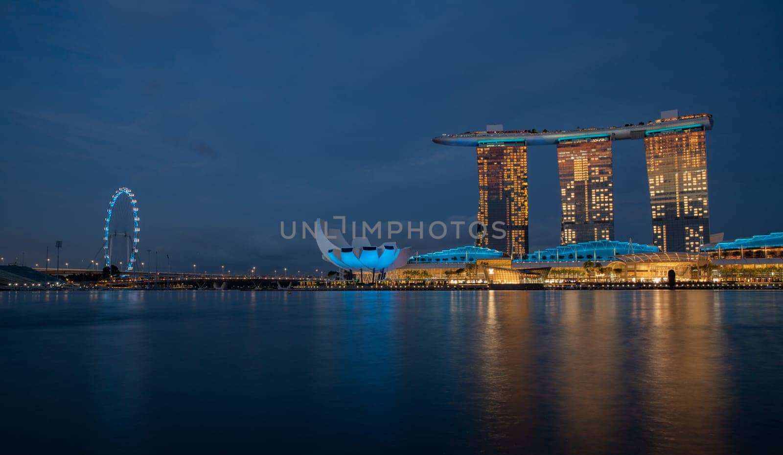 Marina Bay, Singapore - 4, June, 2023 - The view of Art Science Museum and Sands Hotel illuminated at night