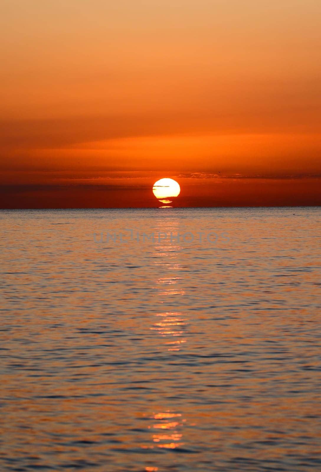 Sunrise over the Mediterranean Sea seen from the beach in Torremolinos. Costa del Sol, Spain