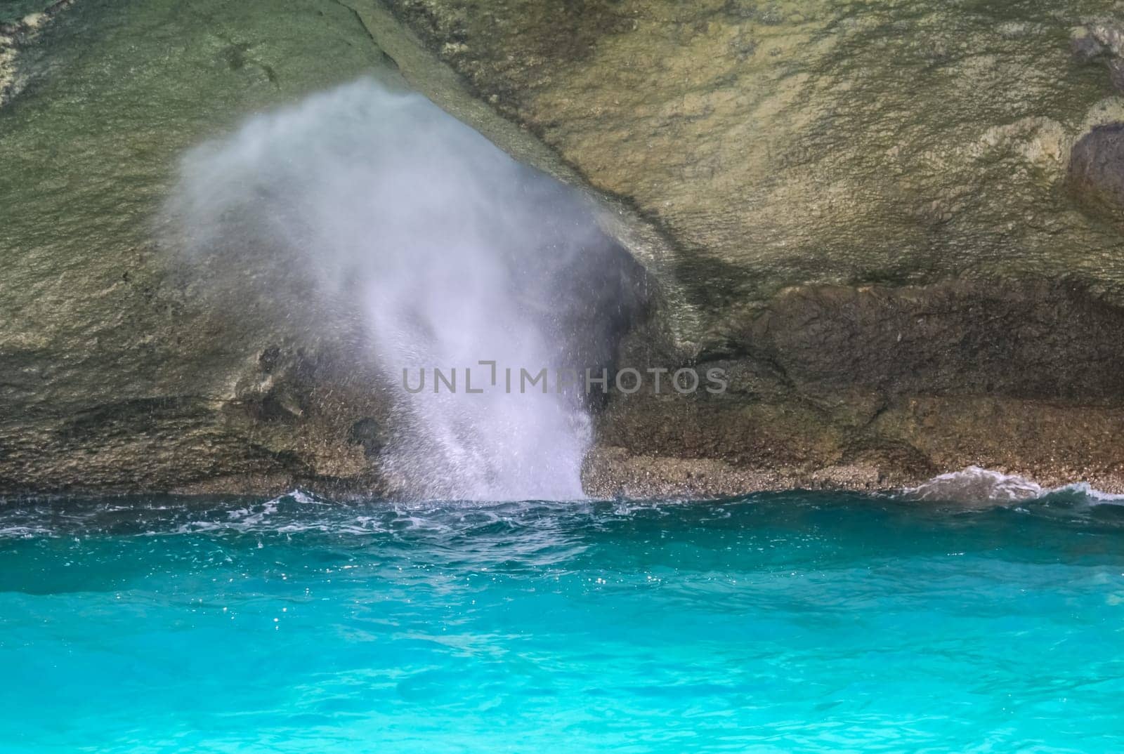 Splashes of waves on the rocks in Phuket.