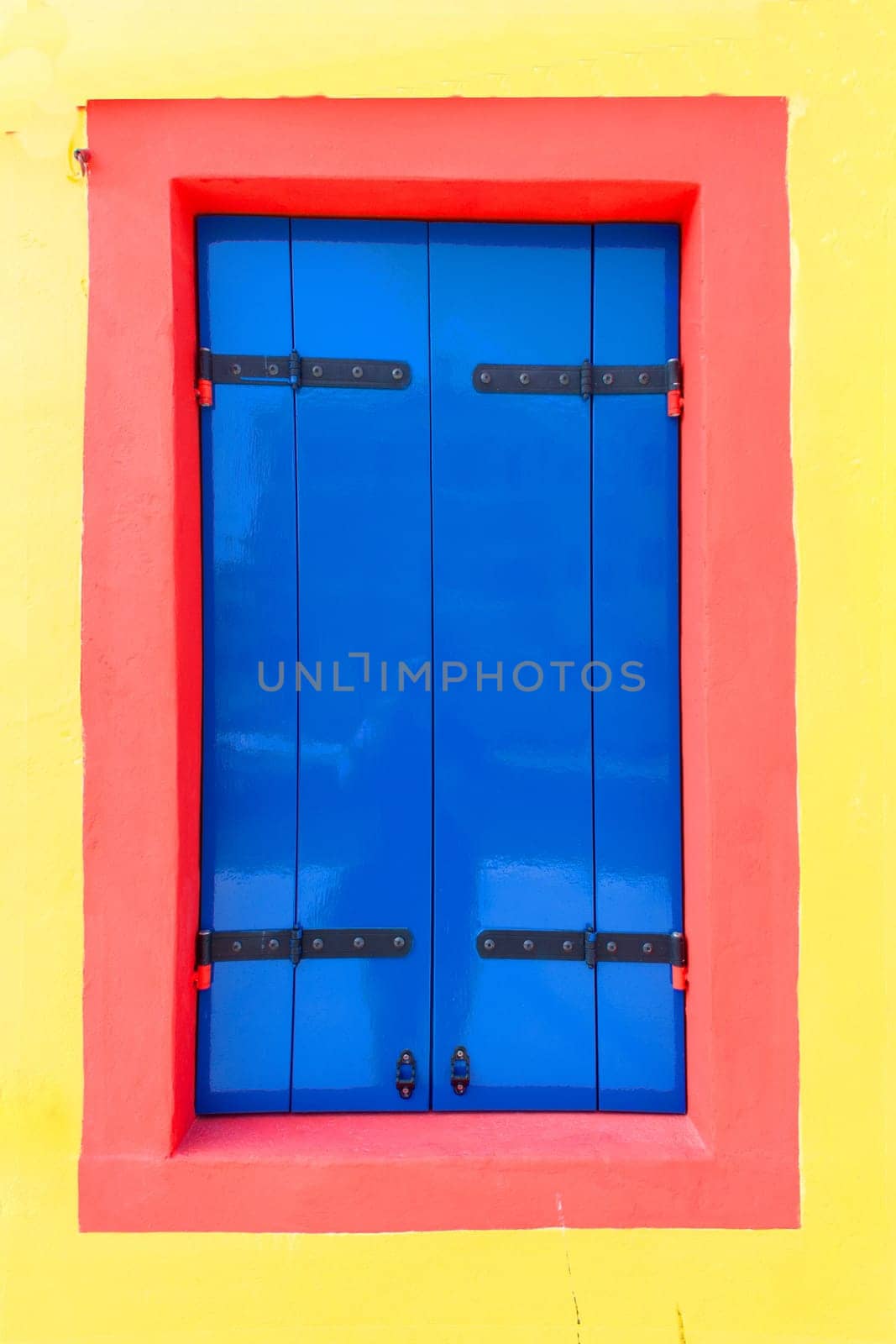 colorful facade of an old fisher house in the village of Burano near Venice