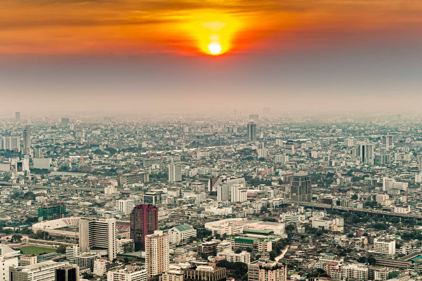 aerial of Bangkok skyline showing in sunset