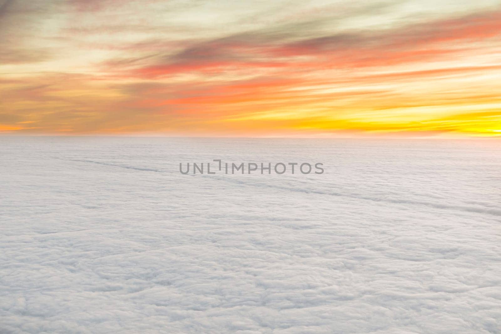 aerial of scenic sunrise with  white puffy clouds