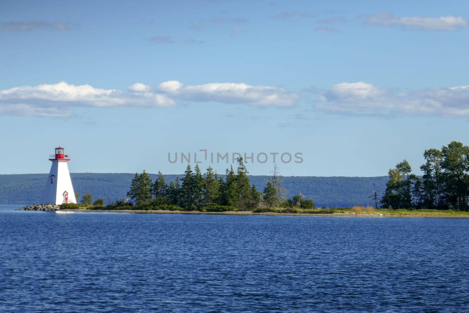Kidston Island Lighthouse at sunset in Baddeck, Nova Scotia, Canada
