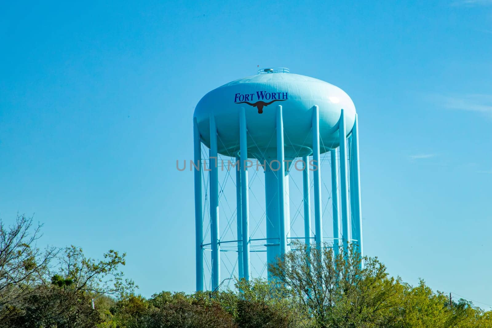 water tank and tower in Fort Worth with the typical longhorn under the name, Texas, USA