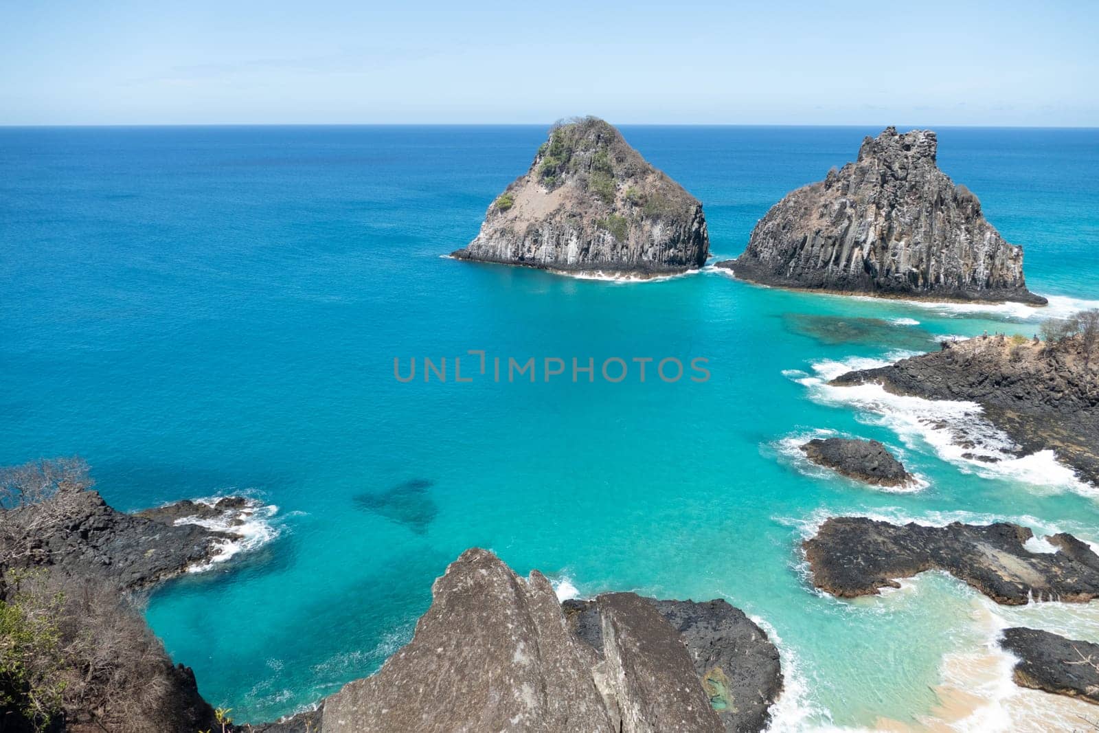 Fernando de Noronha, Brazil. View of Morro dos Dois Irmaos with crystal clear turquoise ocean
