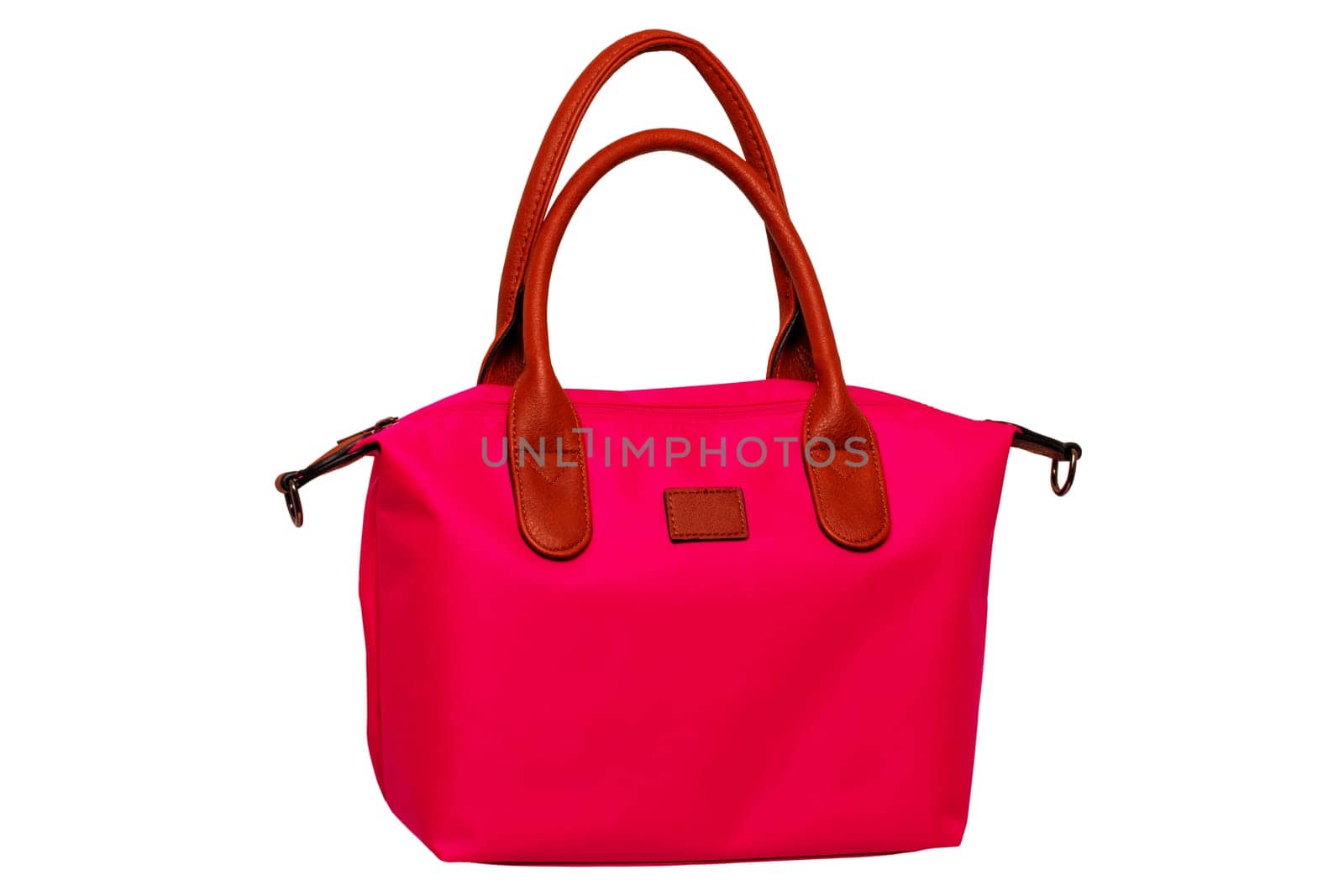 Stylish women's handbag. A fashionable female red luxury handbag with brown leather handles isolated on white. Fashionable womans accessories. Advertising.