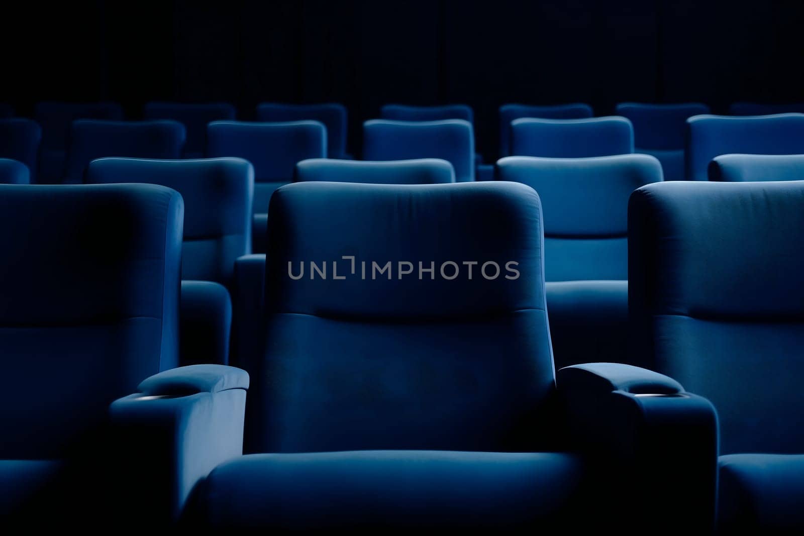 Empty blue seats in cinema, domestic intimacy, zoom in, up close. Neural network generated in January 2024. Not based on any actual scene or pattern.