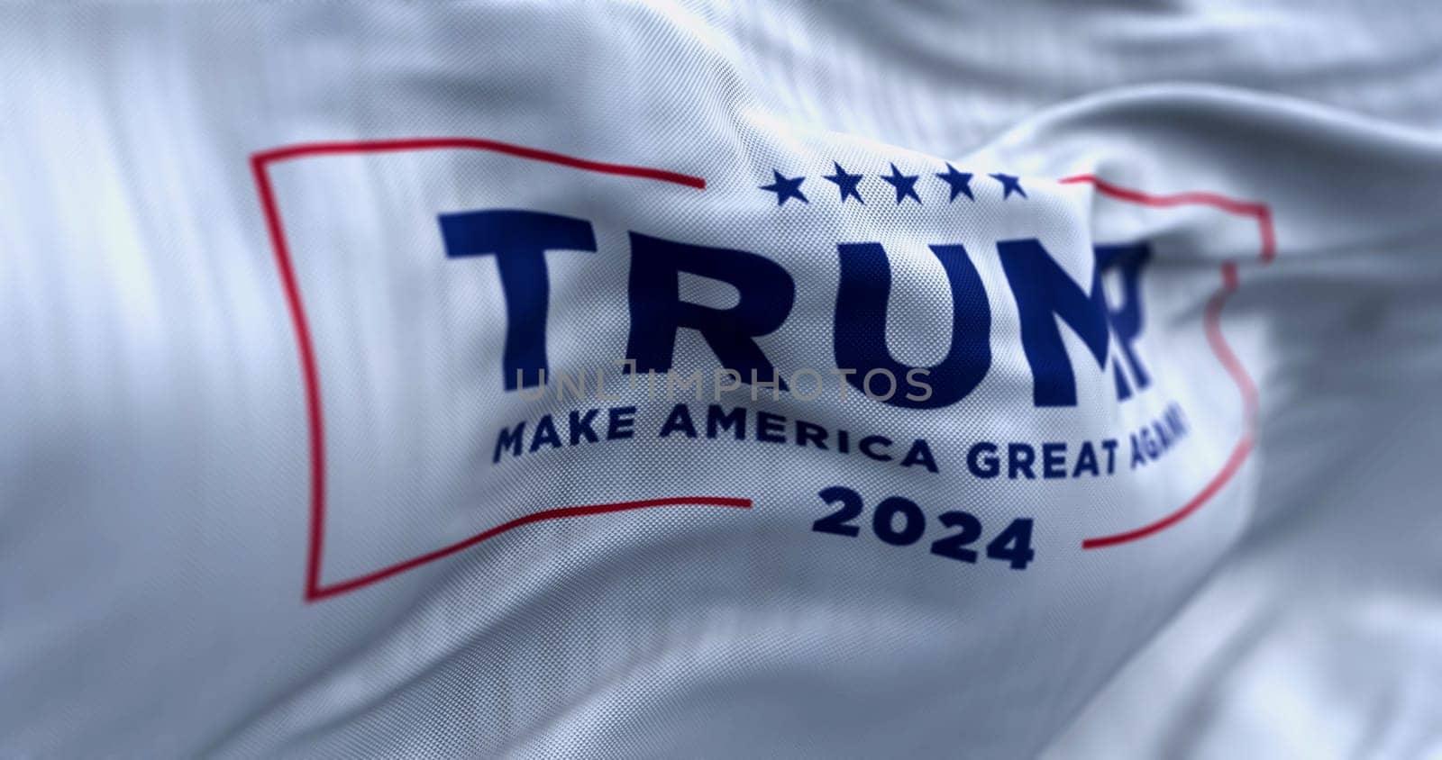 Arlington, US, OCT. 21 2023: Close-up of Donald Trump election campaign flag waving on a clear day. 2024 US presidential election. Illustrative editorial 3d illustration render. Selective focus