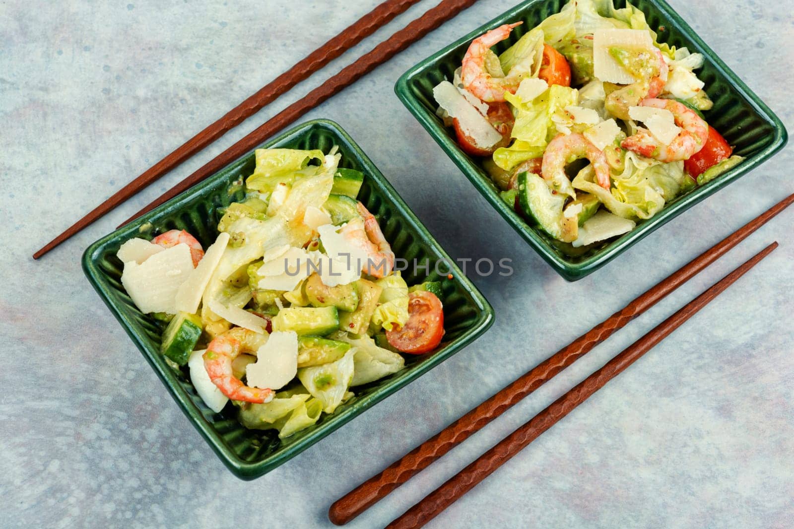 Asian salad with shrimps, prawns avocado, tomato and egg.