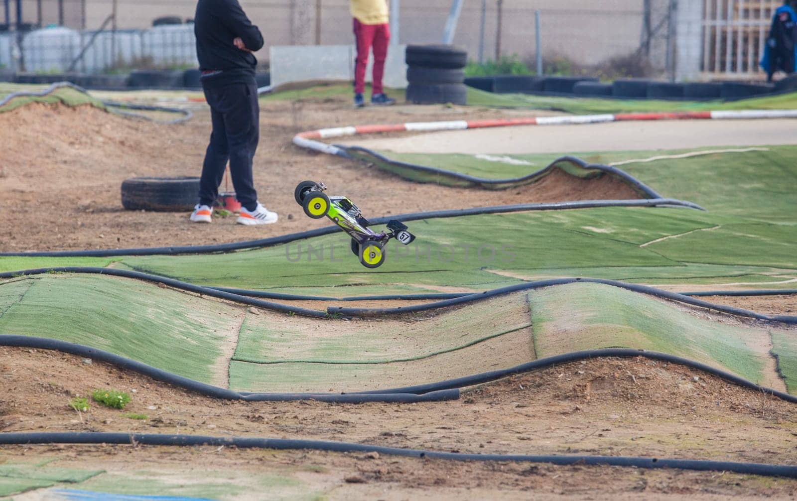 Merida, Spain - Jan 28th, 2024: Extremadura 1/8tt gas Championship RC Car. Cars jumping in an area of undulations