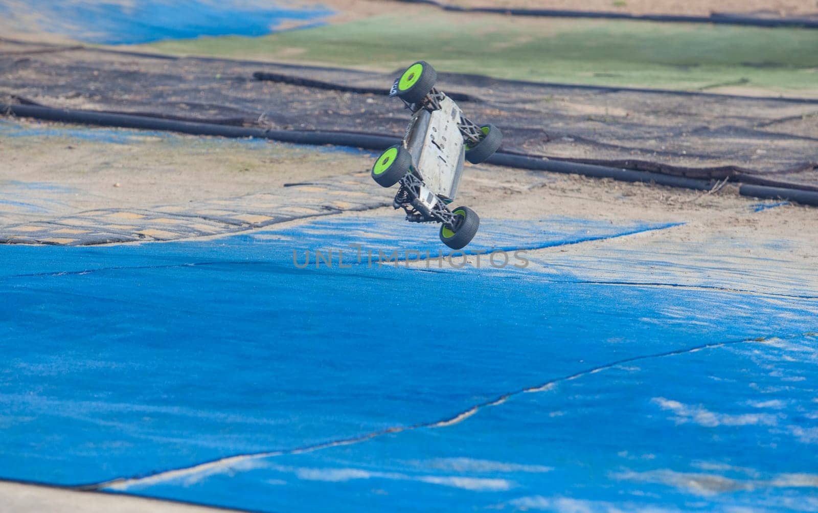 Merida, Spain - Jan 28th, 2024: Extremadura 1/8tt gas Championship RC Car. car in the air about to overturn