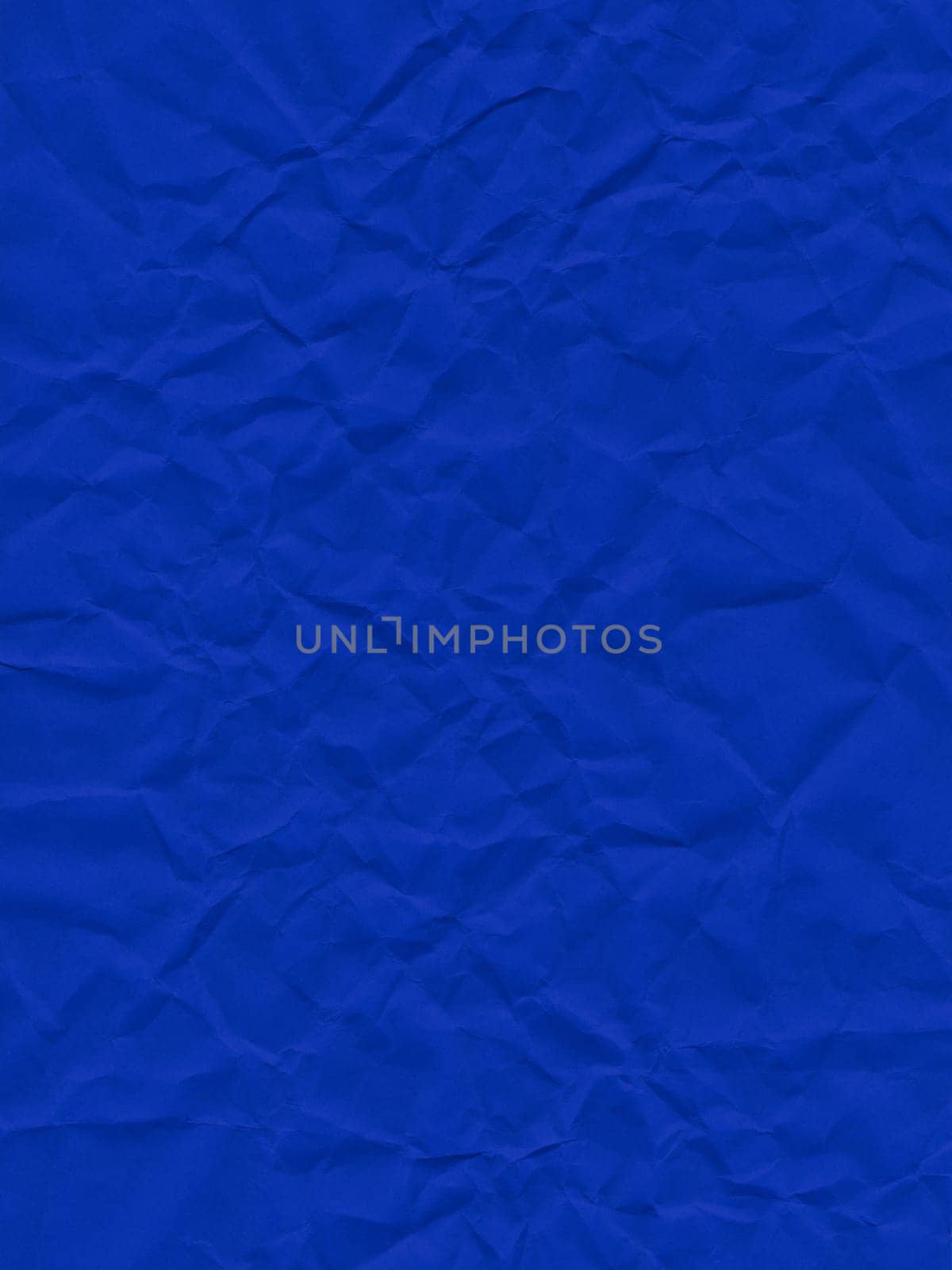 Texture of colored paper, surface of a dark blue sheet of paper