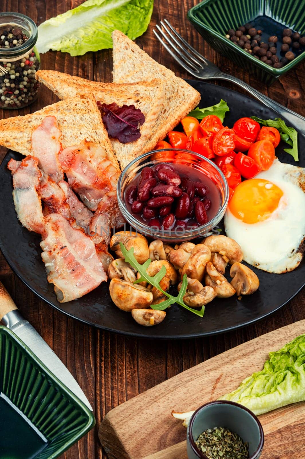English breakfast with fried eggs and bacon. Close up.