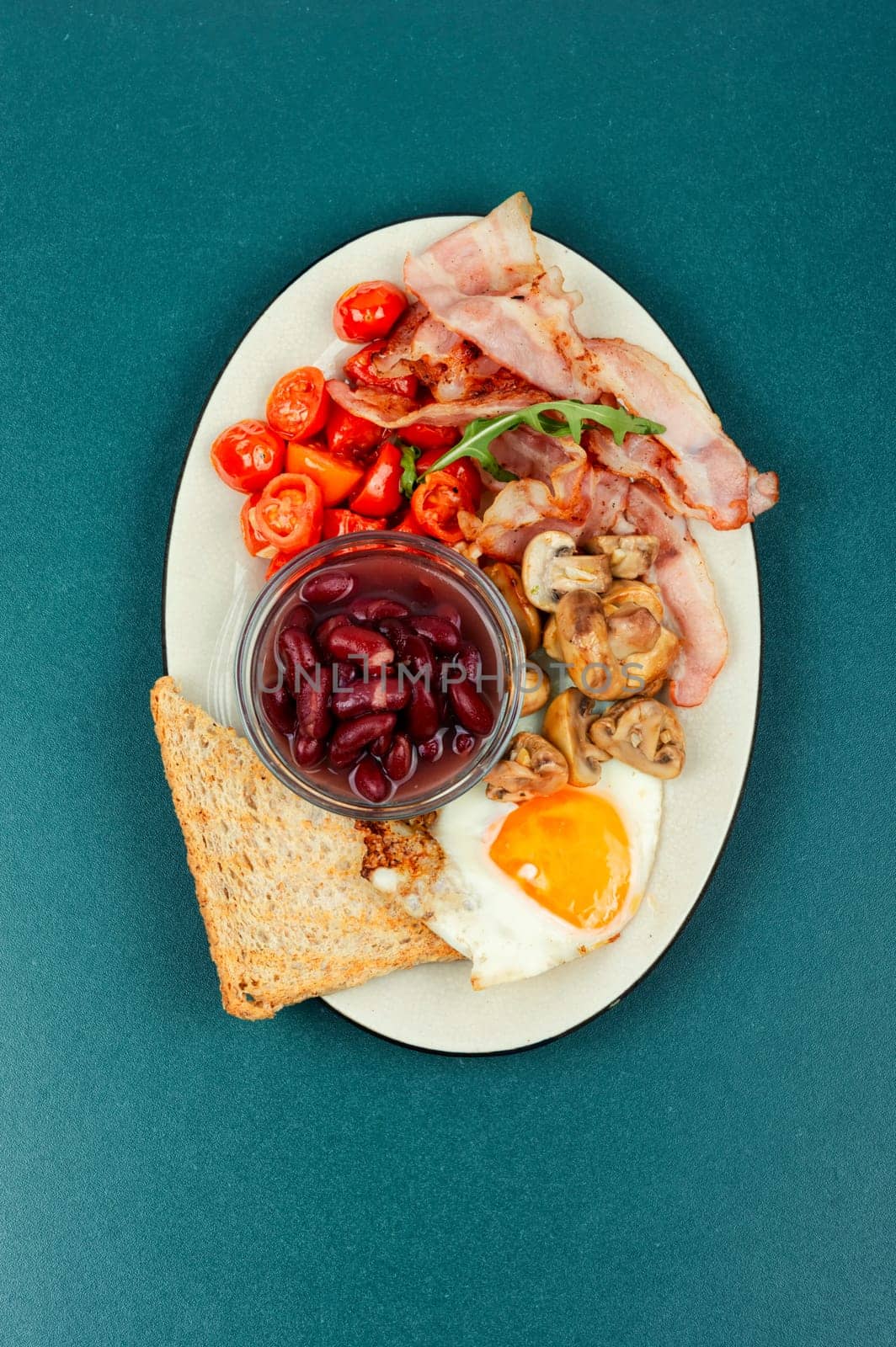 English breakfast with fried eggs and bacon. Close up.