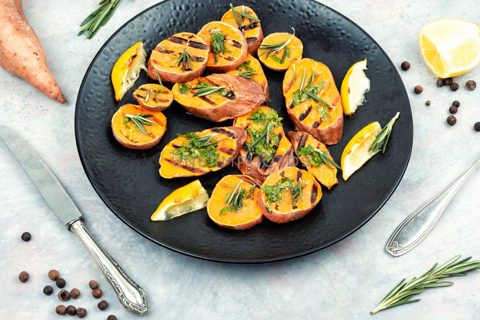 Grilled sweet potato, batata with olive oil and herbs.