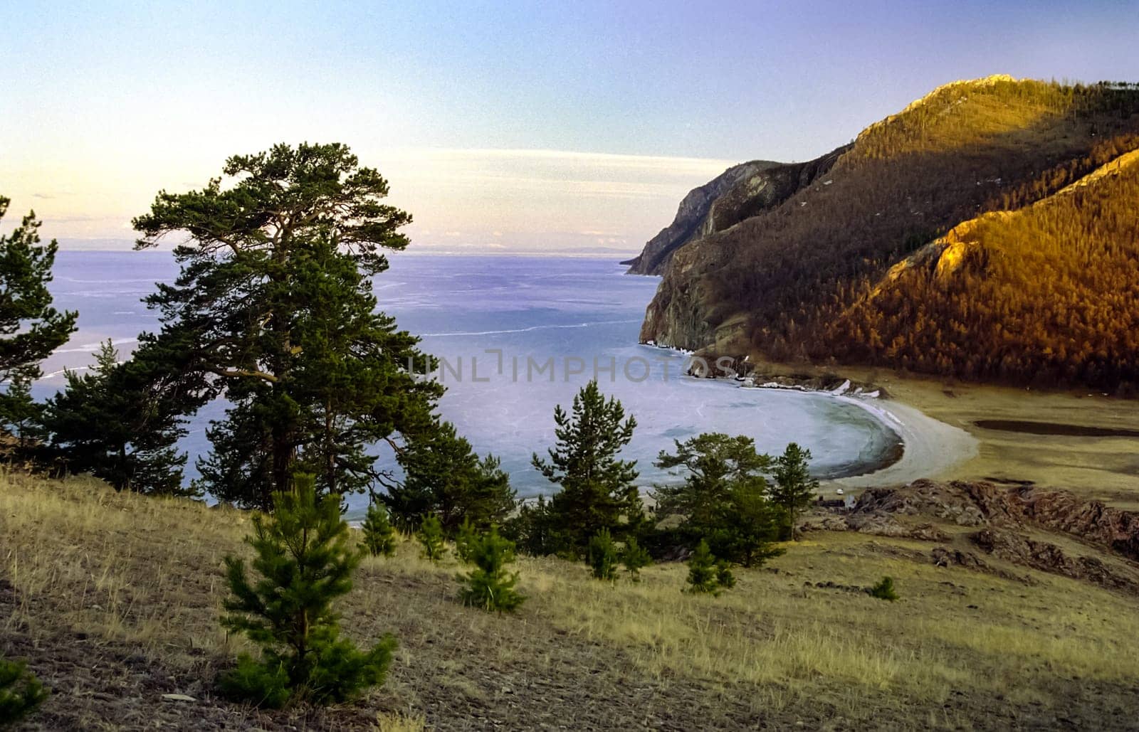 Spring on Baikal, ice and snow on the lake melt. The beauty of the nature of Baikal in the early spring.